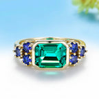Trilogie Moissanite Emerald Sapphire Ring – yellow gold setting